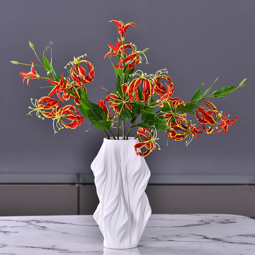 artificial  lily flowers with white vase